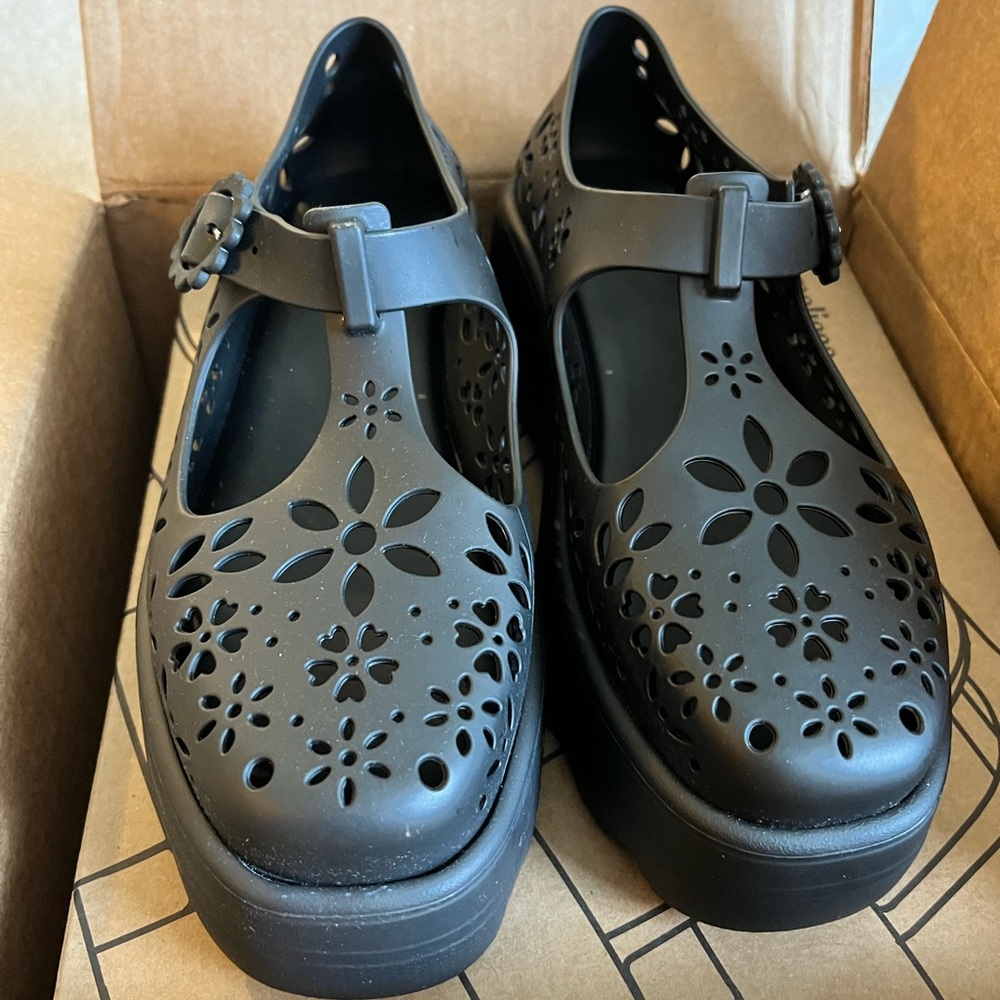 Melissa platform sandal/shoe with cutouts.